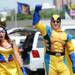 Mrs. Wolverine Amy Vitale and Wolverine Jim Safilian, both of Boca Raton, cheer as they walk through a tailgate before the start of the season home opener against Central Michigan at Michigan Stadium on Saturday, August 31, 2013. Melanie Maxwell | AnnArbor.com